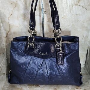 Coach Ashley Embossed Leather Carryall in a metallic blue color 